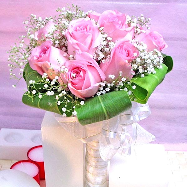 12 Pink roses wrapping with cordyline foliage