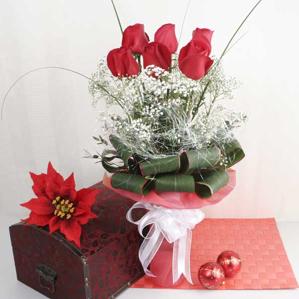 6 Red Roses with babybreath and cordyline foliage in Vase